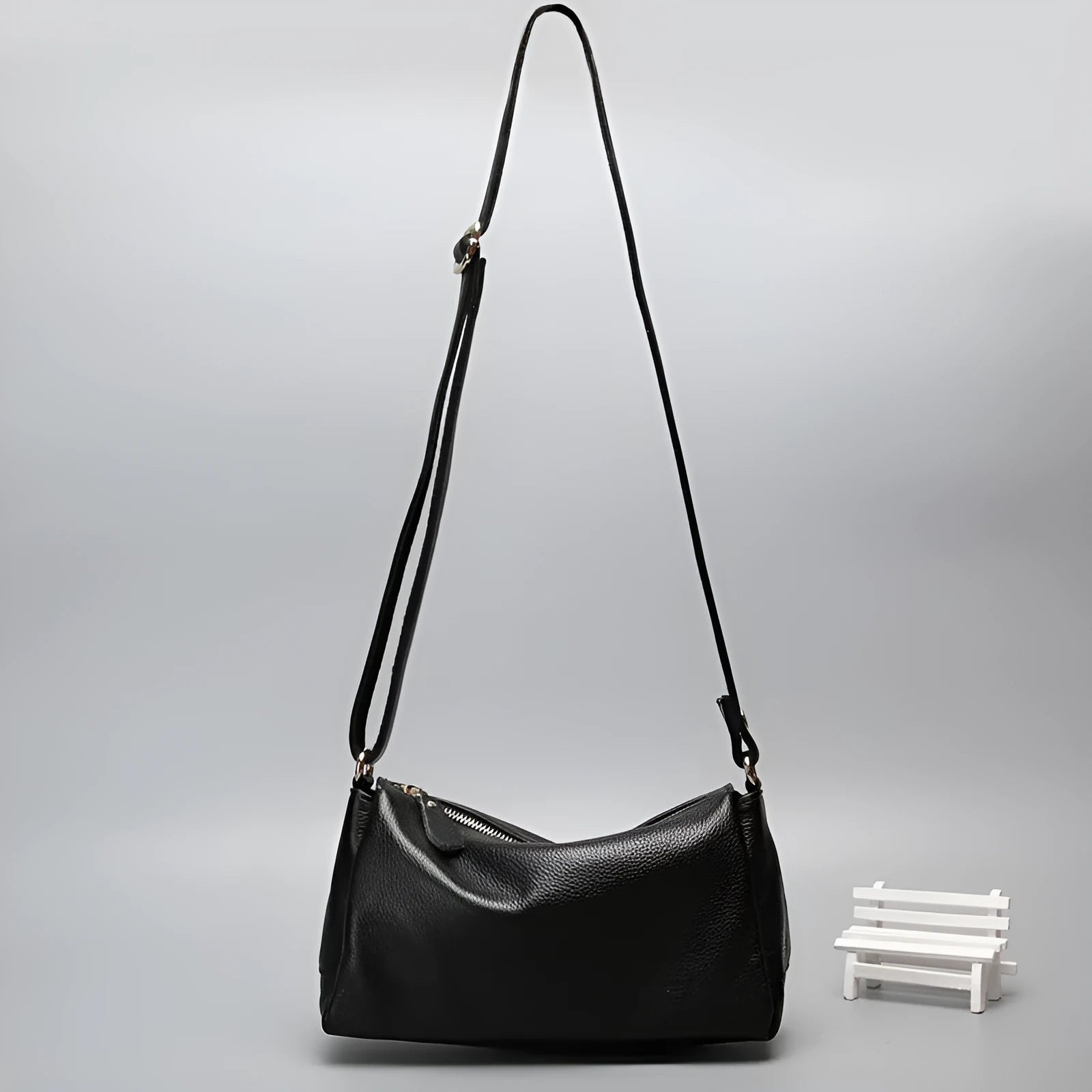 Soft genuine cowhide leather women's crossbody bag in horizontal square shape on a single strap.