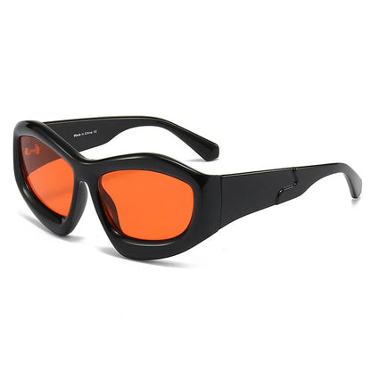 Outdoor unisex sunglasses with concave bubble lenses in black frame on a table.