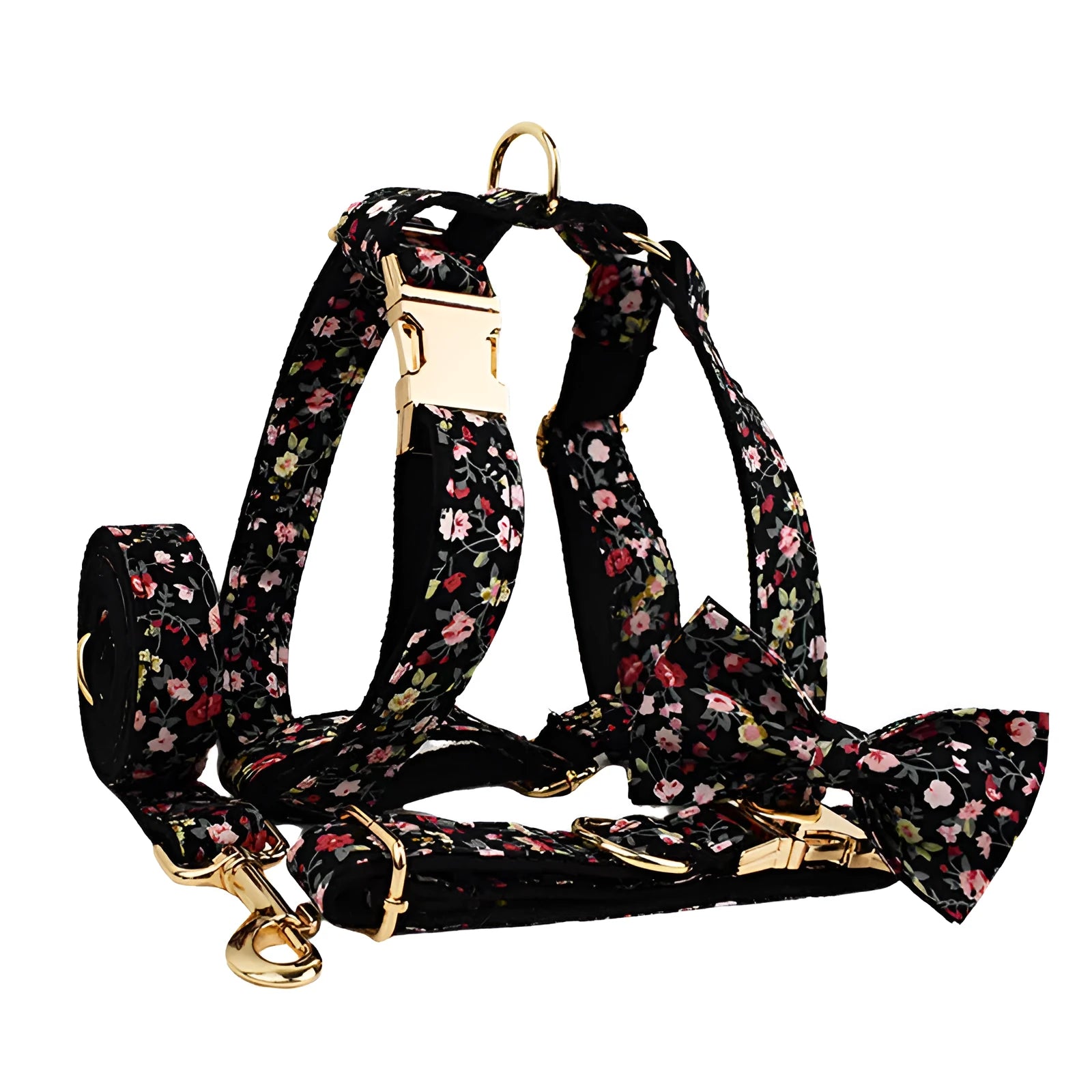 Four-piece dog accessory set showing a cloth collar, leash, vest, and removable bow with printed lettering.