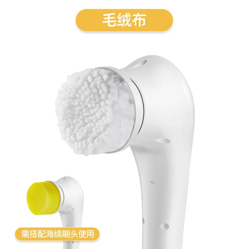 White cordless electric handheld scrubber with five attached brush heads on a kitchen counter