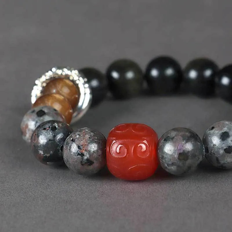 Golden obsidian flame stone red agate unisex bracelet with original design.