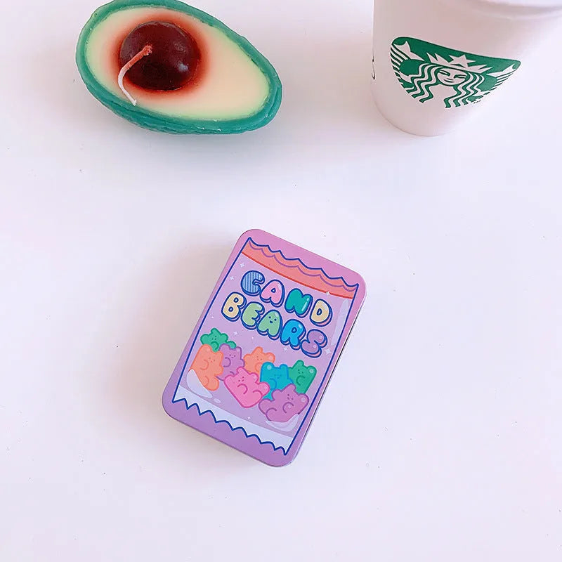 Small white iron storage box with a printed apple girl design on the lid.