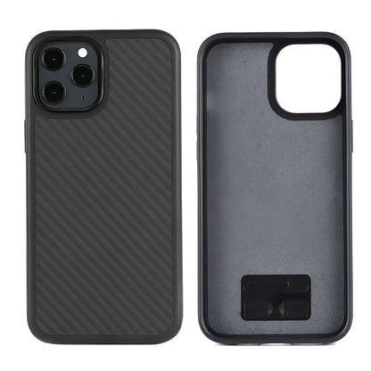 Black solid colour wooden iPhone case with TPU and Kevlar construction on a table.