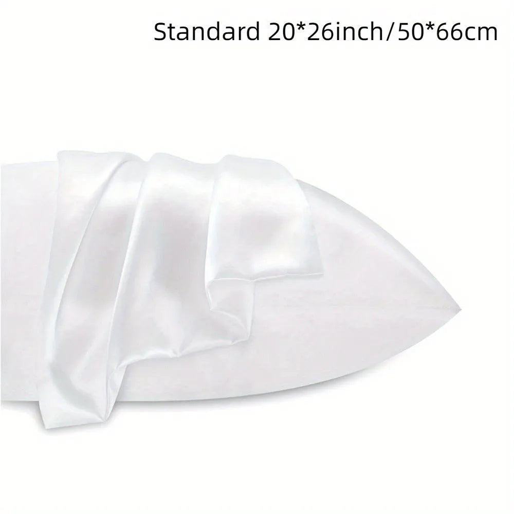 Pair of solid colour satin pillowcases showing smooth plain weave texture and reactive dye colour