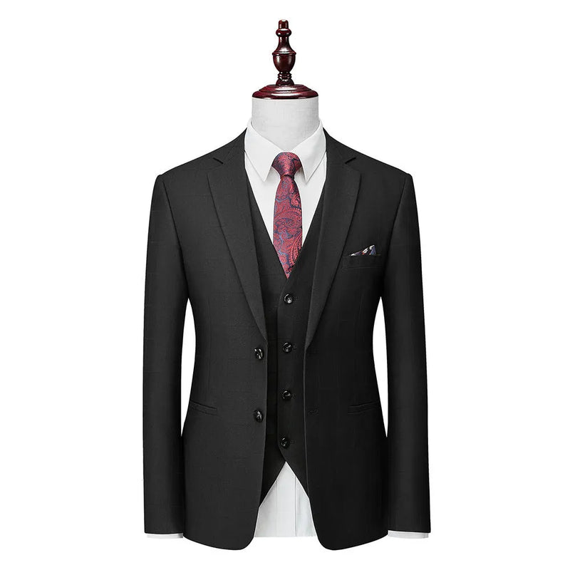 Men's three-piece plaid suit in a cotton-blend fabric with a modern slim fit, designed for light business and leisure settings in spring and autumn.