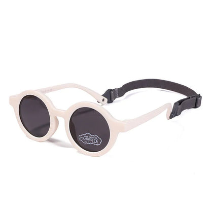 Children's round-frame polarised sunglasses with soft TPEE frame for ages 0-3, shown in assorted colours.