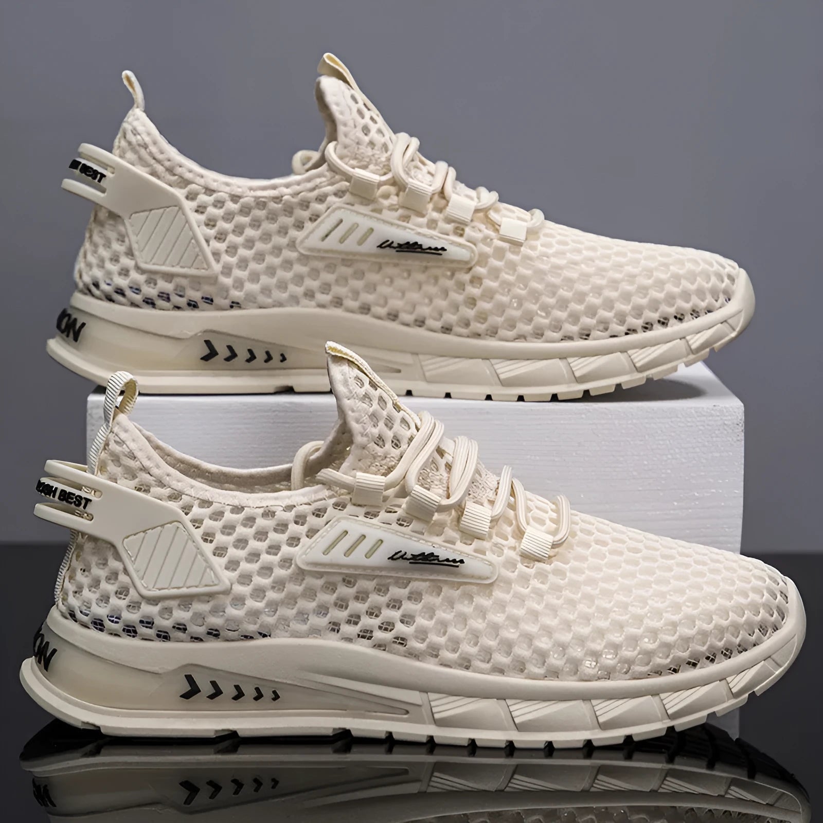 Men's beige casual sneakers with mesh lining and lace-up front on a white background.