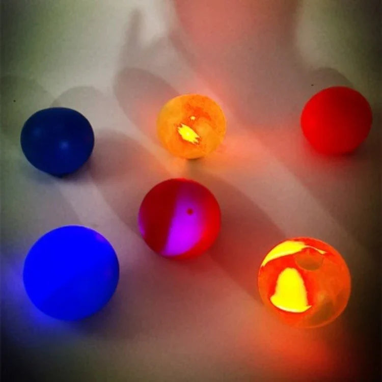 Colorful, luminous stress relief balls with a sticky surface for bouncing, squeezing, and sticking to surfaces