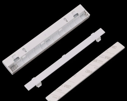 A matte aluminium LED closet light with a magnetic back, shown mounted inside a wooden wardrobe.