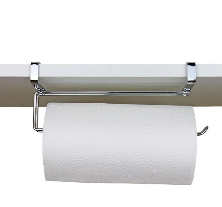 Silver stainless steel paper towel rack hanging on a cabinet door