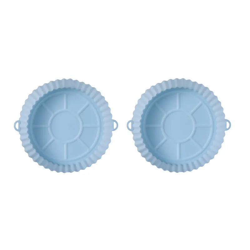 Round blue silicone baking tray mat with 4.5cm sides on a kitchen counter.