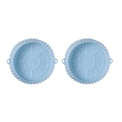 Round blue silicone baking tray mat with 4.5cm sides on a kitchen counter.