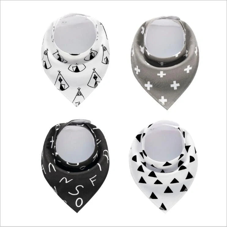 Set of four cotton baby bibs with arrow and wave designs for mess-free feeding