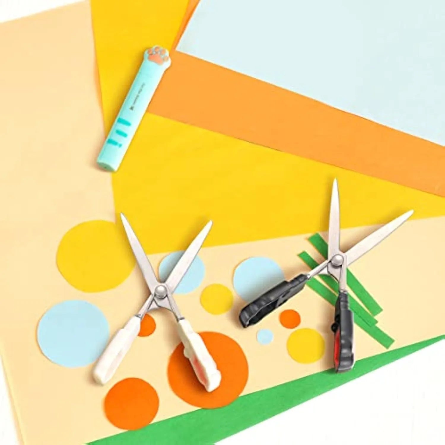 Closed cat paw design mini folding scissors showing safety lock, in choice of colours.