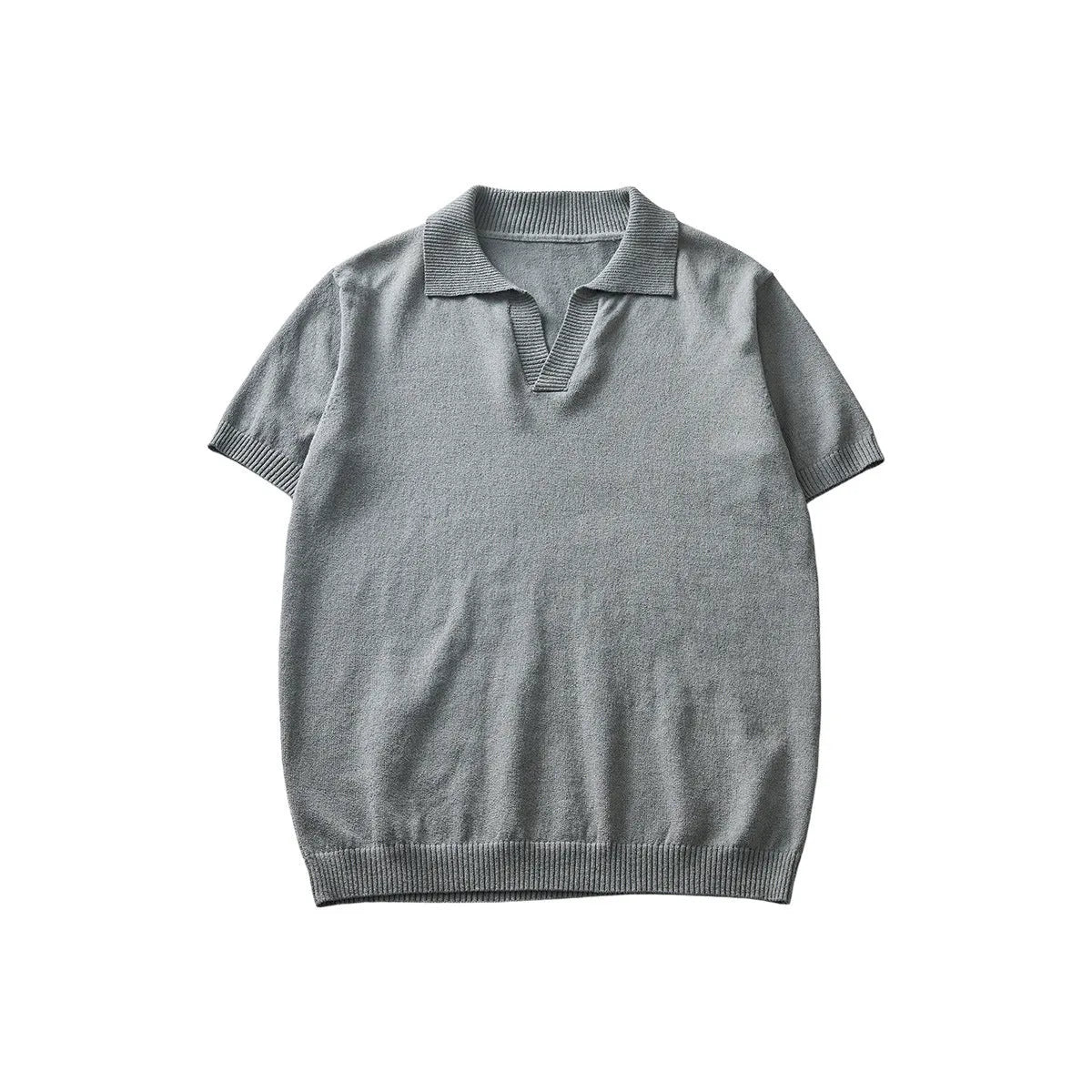 Knitted short-sleeved polo collar casual T-shirt in a solid colour on a hanger.