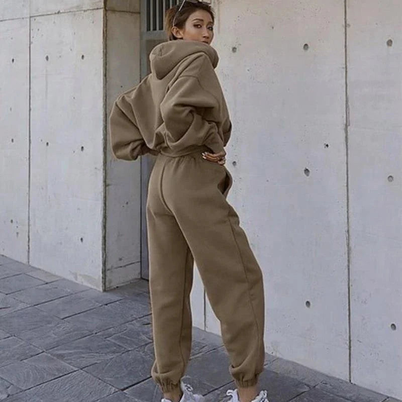 Women's polyester hoodie jacket and sports pants set in various colors for casual and athletic wear