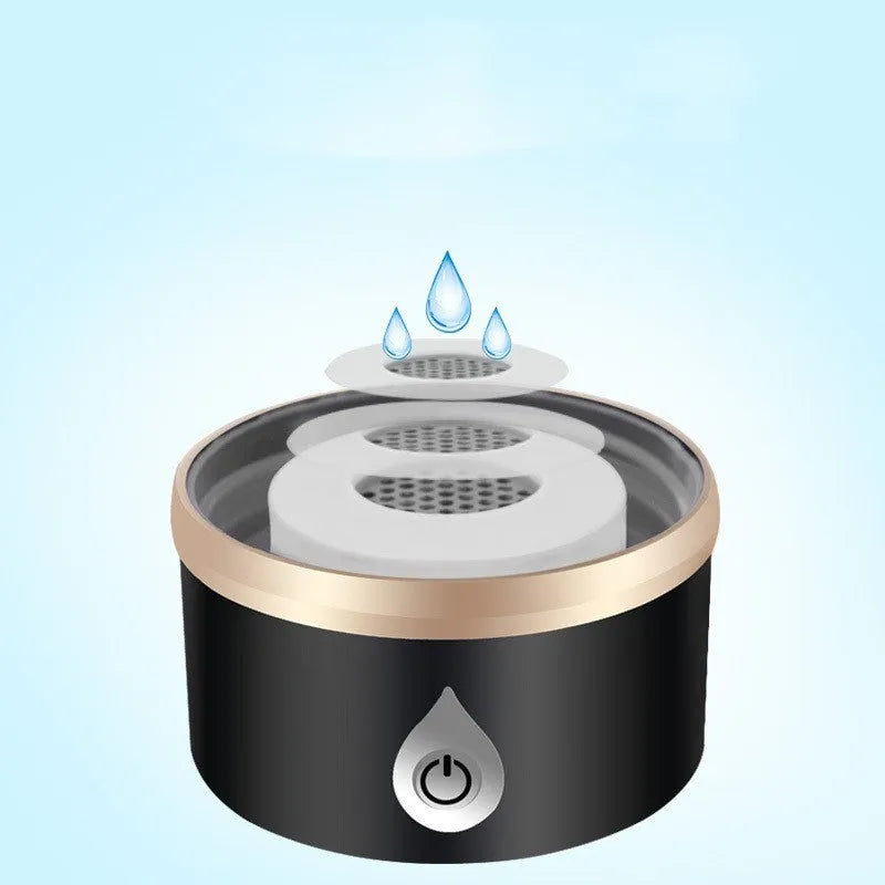 Portable hydrogen water ionizer bottle with high borosilicate glass cup in silver finish.
