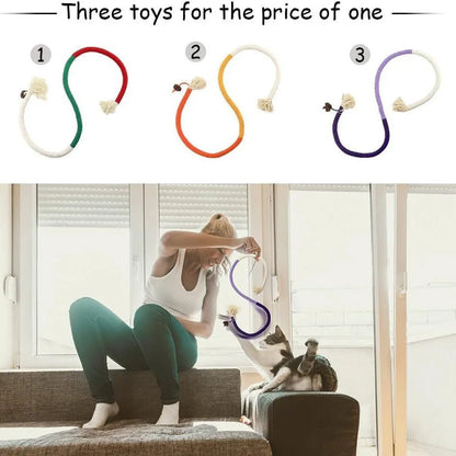 A 70cm long cotton string cat bite rope toy in three colour options: purple, orange, and red with green.