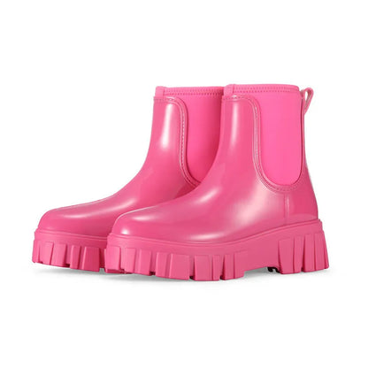 Women's creamy-white low tube PVC rain boots with a flat heel and thickening sole, shown from the side.