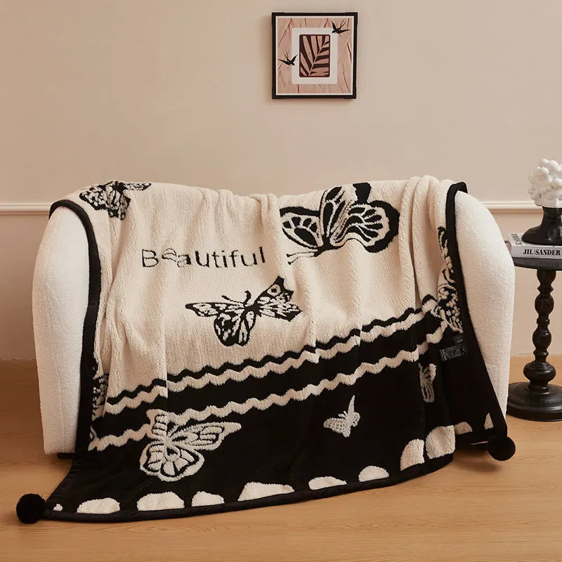 Black and white cationic panda pattern velvet blanket showing texture and modern design