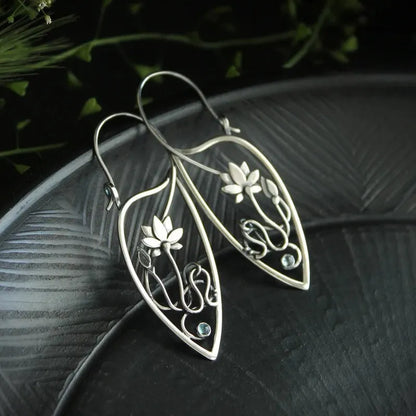 Silver lotus vine design women's earrings with geometric rhinestone details on electroplated alloy