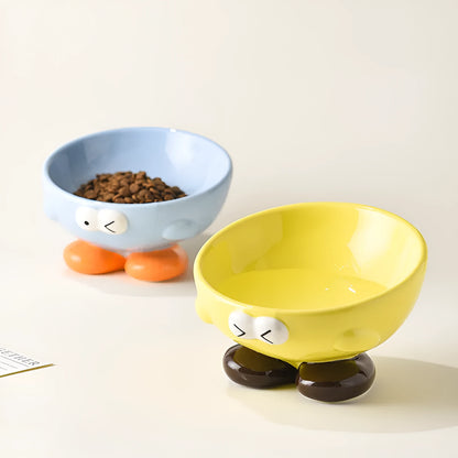 Ceramic slanted pet bowl with decorative expression pattern in blue colour