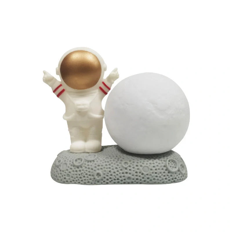 Astronaut-shaped night lamp with colour-changing LED and detachable design