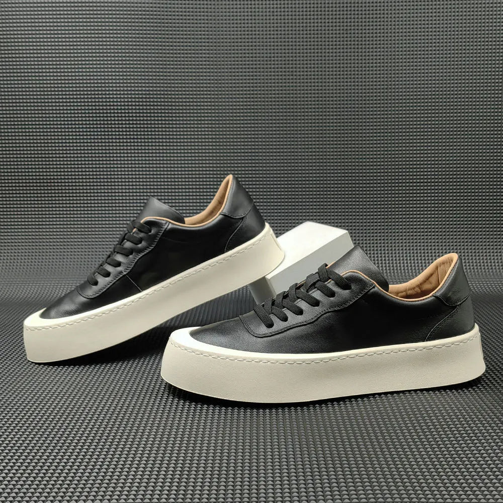 Men's white genuine cowhide board shoes with a thick rubber platform sole and round toe.