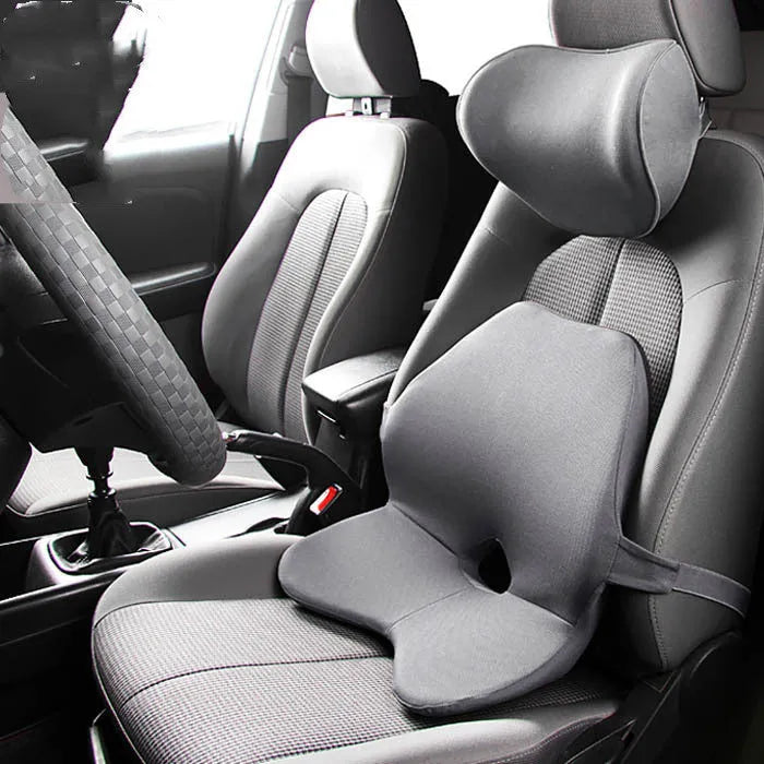 Black memory cotton car seat cushion with lumbar support and integrated headrest on a car seat.
