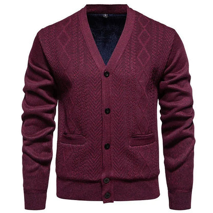 Man wearing a brown striped wool-lined cardigan sweater, showing the open front and long sleeves.