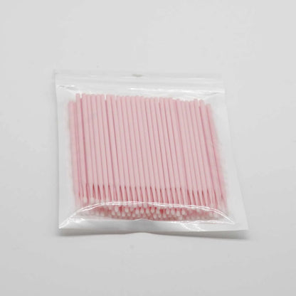 Disposable micro applicator brushes with coloured plastic handles and bendable cotton swab tips