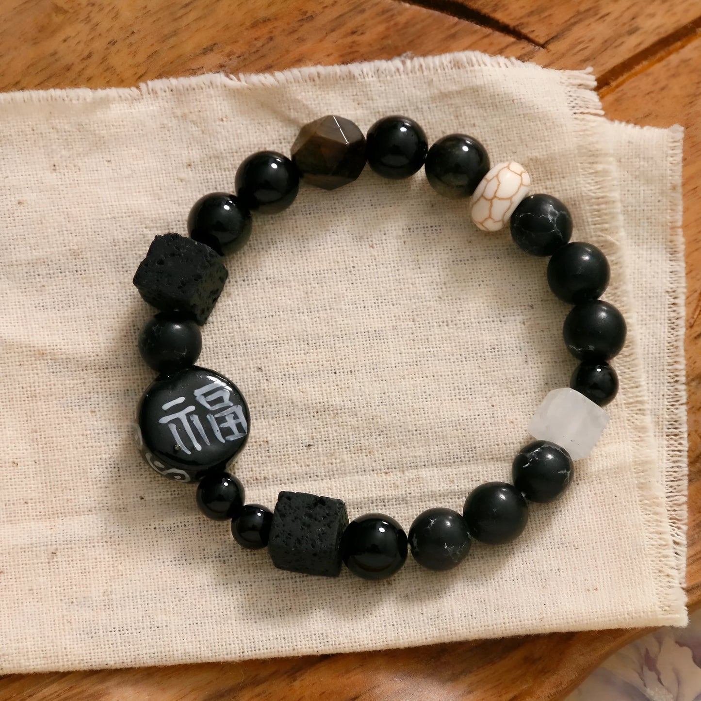 Hand-woven black agate ceramic bracelet with natural glitter stones and geometric design