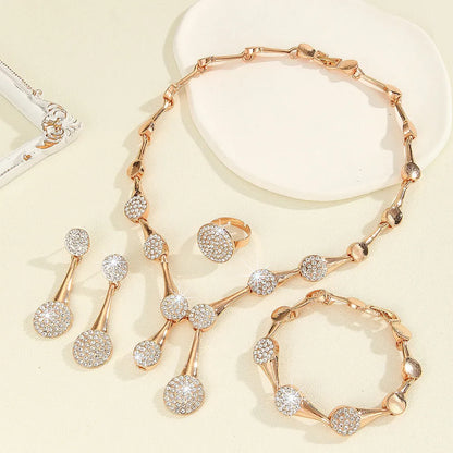 Gold tone alloy jewellery set with flower pendant necklace, bracelet and earrings in plant and flower pattern