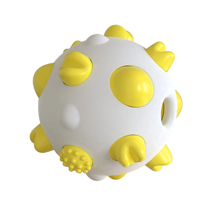 Blue green yellow dog chew ball with textured cleaning bumps and hollow treat-dispensing centre.
