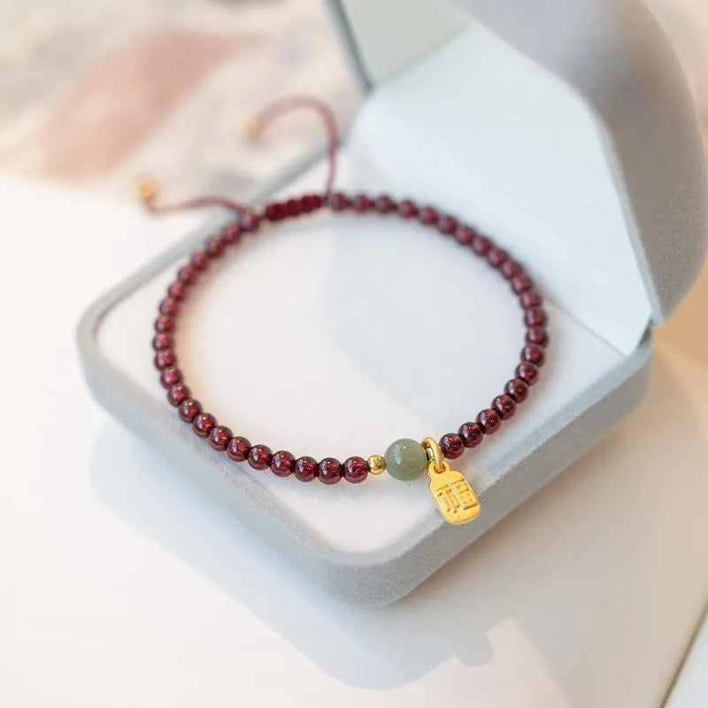 Red rope hand-woven bracelet with strawberry quartz crystals in national tide style