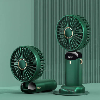 Blue foldable mini handheld electric fan showing its LED display and hanging lanyard.