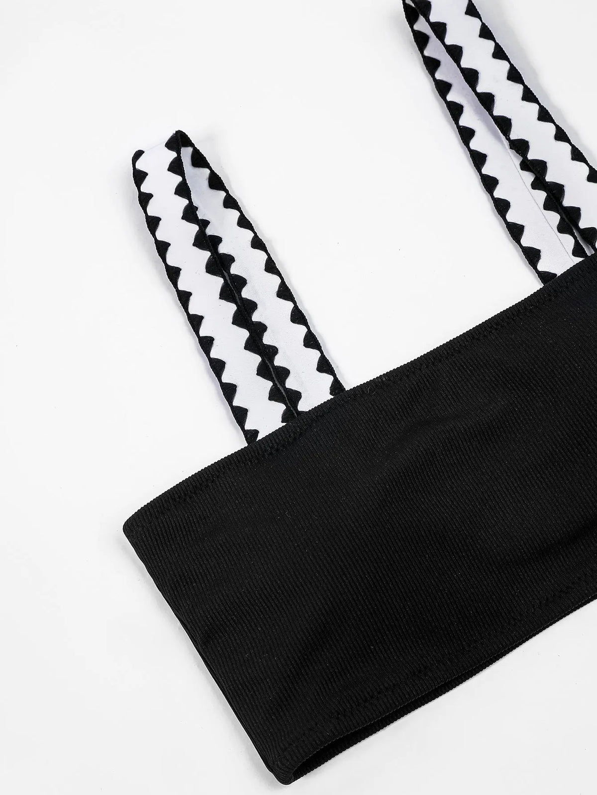 Black women's hollowed-out split swimsuit bikini set on a model.