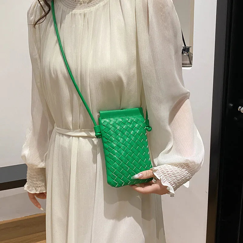 Vintage weave crossbody phone bag in pu leather showing vertical square design and dark cell interior