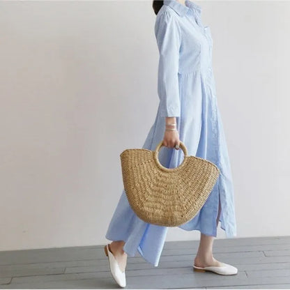 Woven paper rope and straw crescent handbag in natural light brown with hard handle and drawstring closure