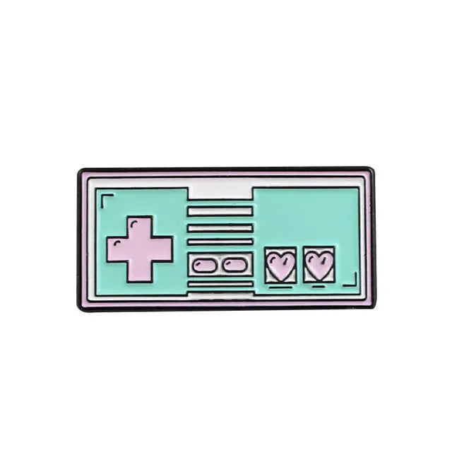 Stereo game console badge made of alloy metal for bag or jacket attachment.