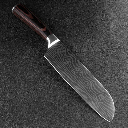 7-inch chef knife with laser Damascus pattern on blade and coloured steel handle on a cutting board.