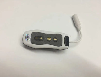 Compact black Bluetooth MP3 headset with clip, shown next to USB charging cable.