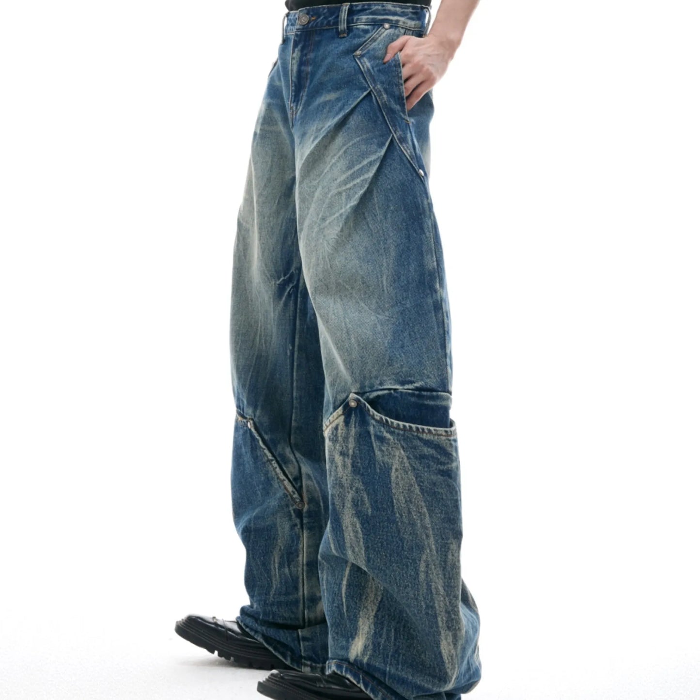 Men's verdant blue jeans with burst pattern, curved knife cut, and loose fit design