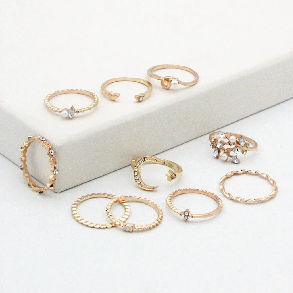 Gold-plated adjustable ring set with moon, star, and leaf charms in a bohemian style
