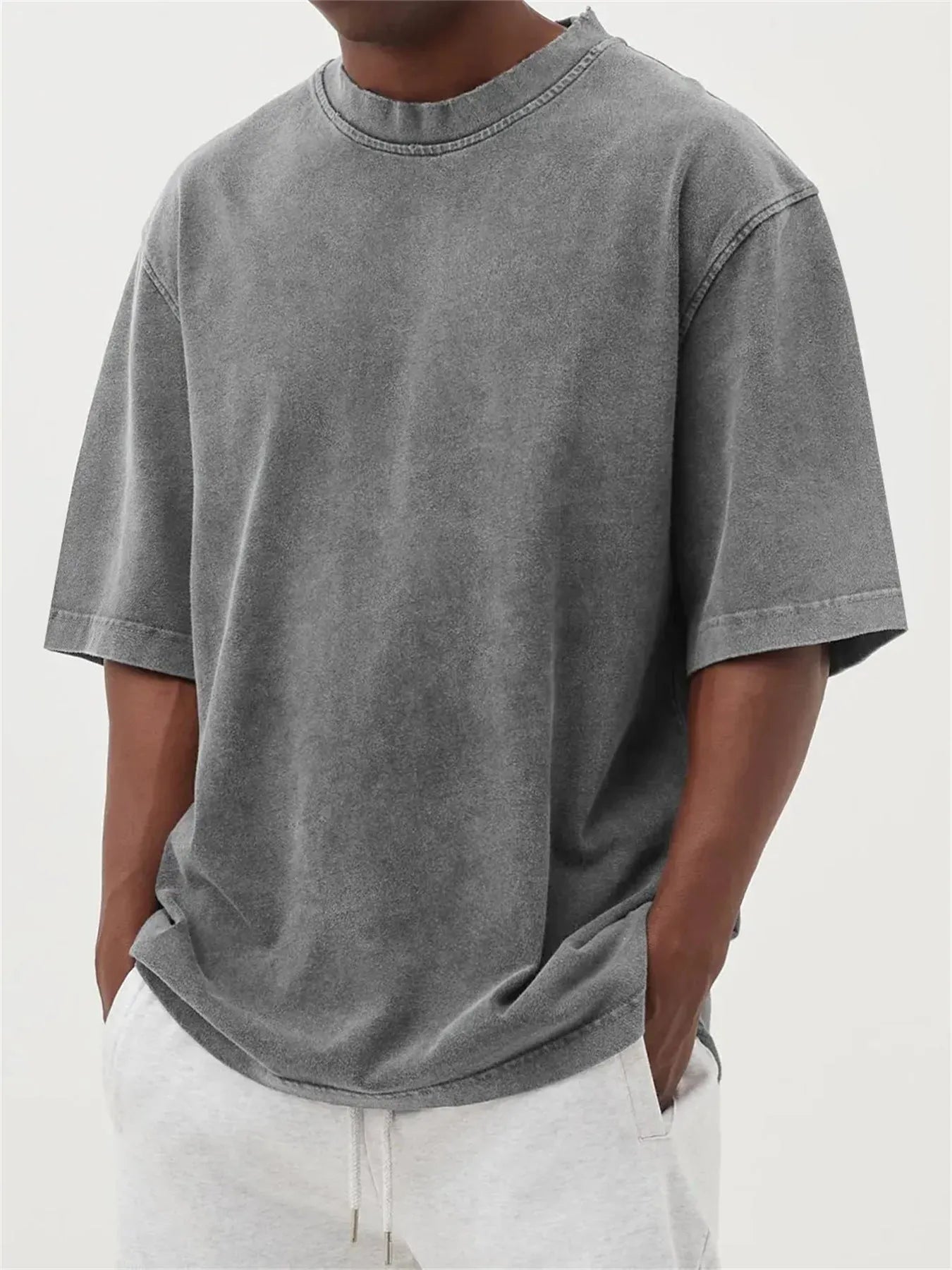 Men's loose fit stone-washed distressed short sleeve t-shirt in solid colour