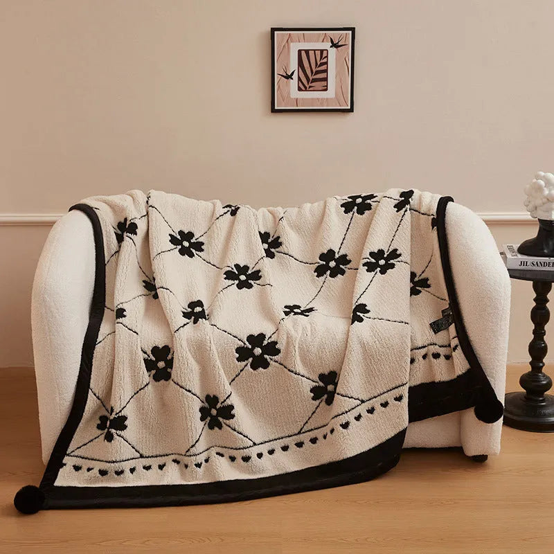 Black and white cationic panda pattern velvet blanket showing texture and modern design