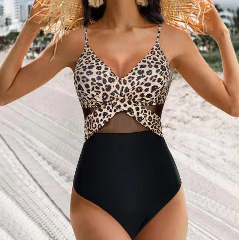 One-piece swimsuit with halter-neck and cross-strap design, available in various solid colors and a leopard print pattern