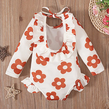 Girl's floral print swimsuit with open back crew neck design in polyester fabric