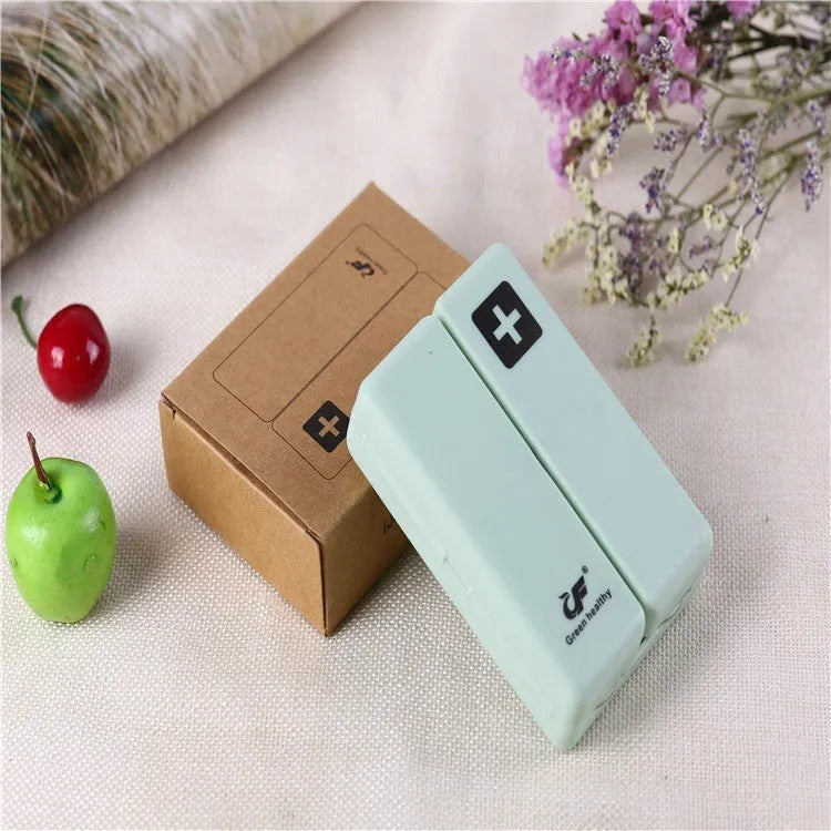 Blue foldable pill box with seven compartments and magnetic closure showing open and closed positions