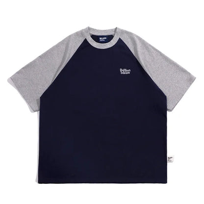 Men's blue loose-fit Japanese style long sleeve t-shirt with raglan sleeves on a hanger.